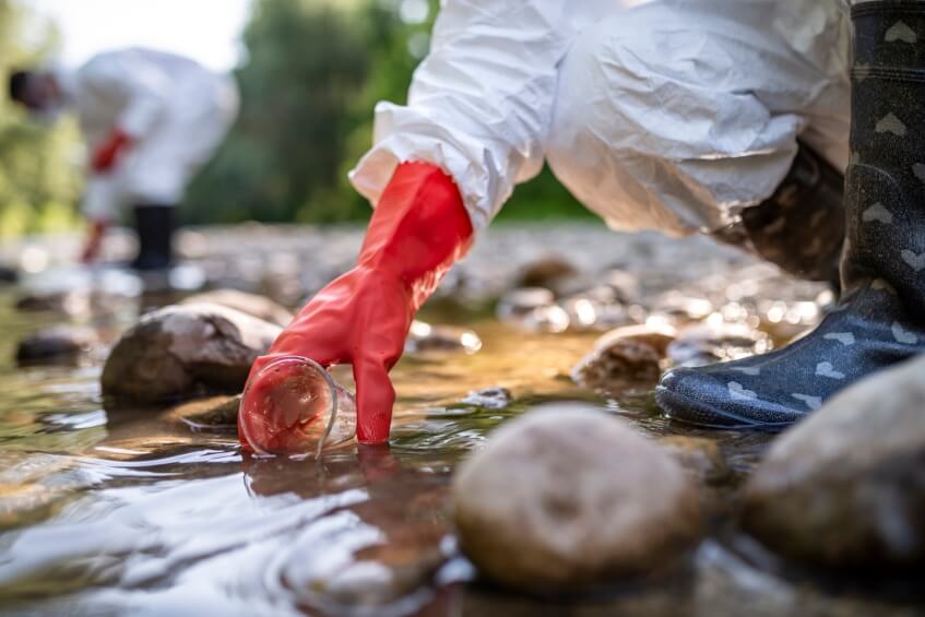 scientist examining contaminated water